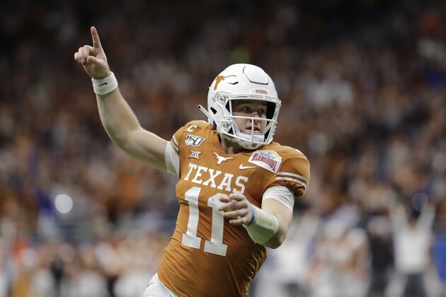 Texas quarterback Sam Ehlinger celebrates a touchdown against Utah during the first half of the Alamo Bowl NCAA college football game in San Antonio, Tuesday, Dec. 31, 2019. (AP Photo/Austin Gay)
