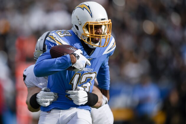 Los Angeles Chargers wide receiver Keenan Allen, right, is tackled by by Oakland Raiders defensive end Josh Mauro during the first half of an NFL football game Sunday, Dec. 22, 2019, in Carson, Calif. (AP Photo/Kelvin Kuo)