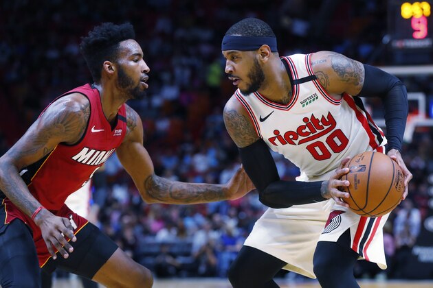 Portland Trail Blazers forward Carmelo Anthony (00) looks for an opening past Miami Heat forward Derrick Jones Jr. during the first half of an NBA basketball game, Sunday, Jan. 5, 2020, in Miami. (AP Photo/Wilfredo Lee) Portland Trail Blazers forward Carmelo Anthony (00) looks for an opening past Miami Heat forward Derrick Jones Jr. during the first half of an NBA basketball game, Sunday, Jan. 5, 2020, in Miami. (AP Photo/Wilfredo Lee)