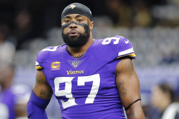 FILE - In this Jan. 5, 2020, file photo, Minnesota Vikings defensive end Everson Griffen (97) warms up before an NFL wild-card playoff football game against the New Orleans Saints in New Orleans. Vikings defensive end Everson Griffen will become a free agent for the first time in his 11-year career. He's coming off a bounce-back season for the longest-tenured player on the team. Griffen has chosen to exercise his option to void the remaining three years on his contract, a person with knowledge of the decision confirmed to The Associated Press. (AP Photo/Brett Duke, File)