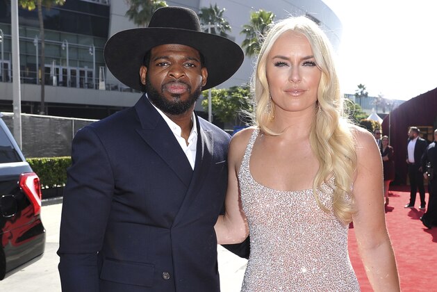 FILE - In this July 10, 2019 file photo, P.K. Subban, left, of the New Jersey Devils, and Lindsey Vonn arrive at the ESPY Awards at Microsoft Theater in Los Angeles. Vonn popped the question to hockey star Subban. “Merry Christmas and happy holidays everyone!! On our 2 year anniversary, in a “non traditional” move, I asked PK to marry me and he said, Yes,