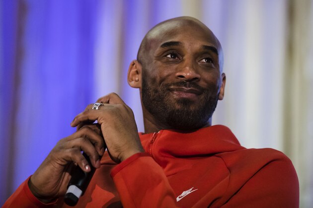 Former Los Angeles Lakers NBA basketball player Kobe Bryant listens to a question as he meets with students at Andrew Hamilton School in Philadelphia, Thursday, March 21, 2019. Kobe Bryant was promoting the book The Wizenard Series: Training Camp he created with writer Wesley King. (AP Photo/Matt Rourke)