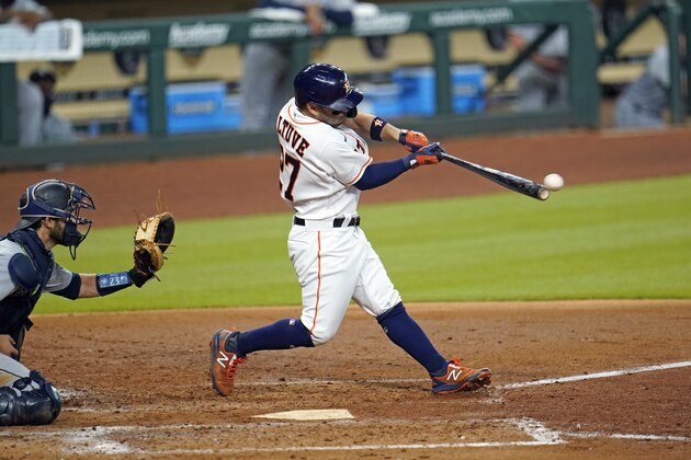 Houston Astros' Jose Altuve (27) hits an RBI-double as Seattle Mariners catcher Austin Nola reaches for the pitch during the third inning of a baseball game Monday, July 27, 2020, in Houston. (AP Photo/David J. Phillip) Houston Astros' Jose Altuve (27) hits an RBI-double as Seattle Mariners catcher Austin Nola reaches for the pitch during the third inning of a baseball game Monday, July 27, 2020, in Houston. (AP Photo/David J. Phillip)