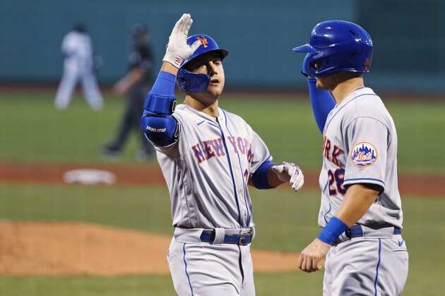 New York Mets' Michael Conforto is congratulated by J.D. Davis, right, after his two-run home run off Boston Red Sox pitcher Josh Osich during the second inning of a baseball game Monday, July 27, 2020, at Fenway Park in Boston. (AP Photo/Charles Krupa)