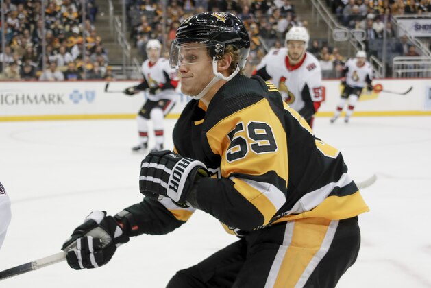 Pittsburgh Penguins' Jake Guentzel (59) plays against the Ottawa Senators during the second period of an NHL hockey game, Monday, Dec. 30, 2019, in Pittsburgh. (AP Photo/Keith Srakocic)