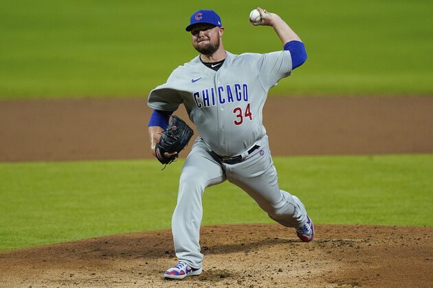 Chicago Cubs starting pitcher Jon Lester (34)  throws during the first inning of a baseball game against the Cincinnati Reds at Great American Ballpark in Cincinnati, Monday, July 27, 2020. (AP Photo/Bryan Woolston)