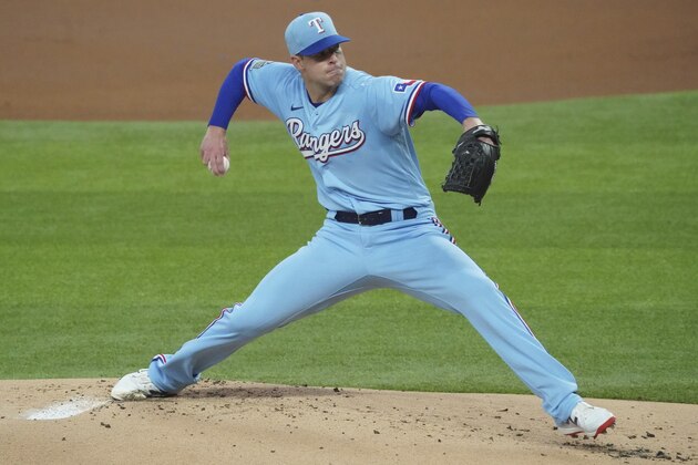 Texas Rangers starting pitcher Corey Kluber pitches against the Colorado Rockies in the first inning of a baseball game Sunday, July 26, 2020, in Arlington, Texas. (AP Photo/Louis DeLuca)