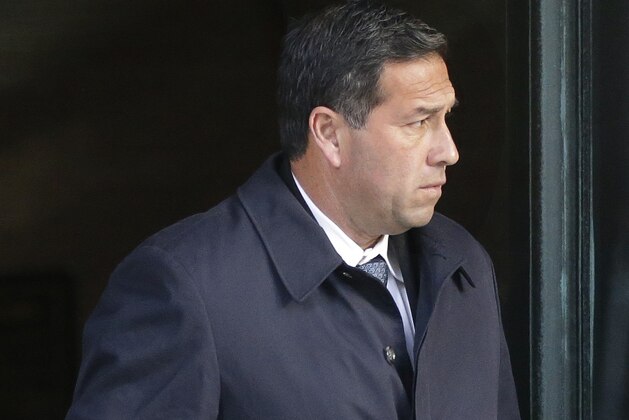 Jorge Salcedo, former UCLA soccer coach, departs federal court in Boston on Monday, March 25, 2019, after facing charges in a nationwide college admissions bribery scandal. (AP Photo/Steven Senne)