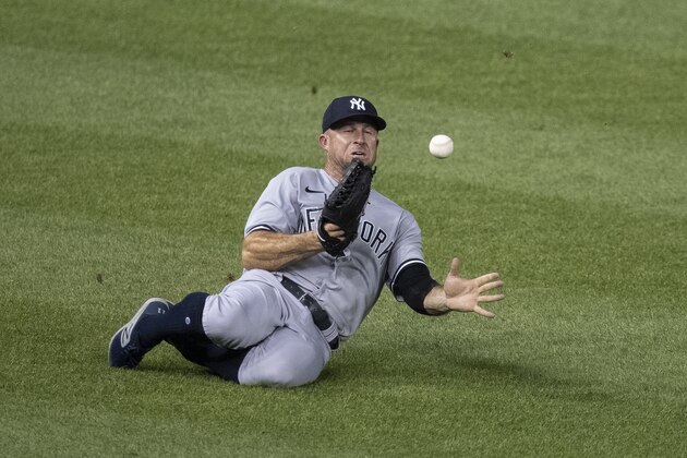New York Yankees left fielder Brett Gardner cannot catch a hit by Washington Nationals' Kurt Suzuki for a single during the fourth inning of a baseball game at Nationals Park, Saturday, July 25, 2020, in Washington. (AP Photo/Alex Brandon)