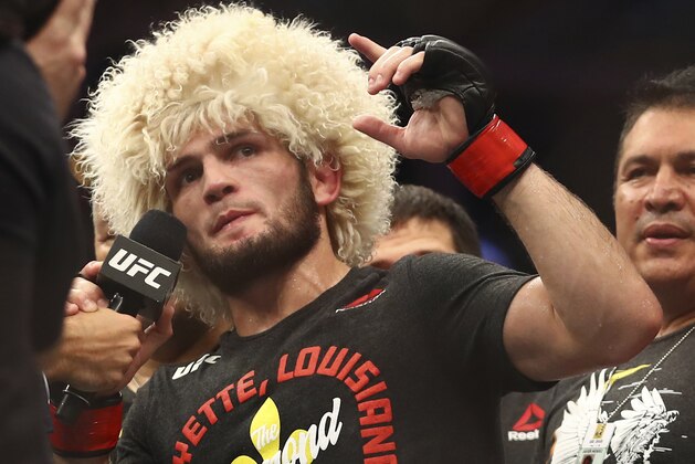 Russian UFC fighter Khabib Nurmagomedov speaks after wining against UFC fighter Dustin Poirier, of Lafayette, La., during Lightweight title mixed martial arts bout at UFC 242, in Yas Mall in Abu Dhabi, United Arab Emirates, Saturday , Sept.7 2019. (AP Photo/ Mahmoud Khaled)