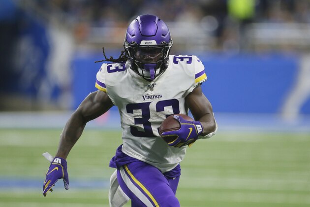 FILE - In this Oct. 20, 2019, file photo, Minnesota Vikings running back Dalvin Cook rushes during the second half of an NFL football game against the Detroit Lions, in Detroit. The Vikings have centered their offense around running back Dalvin Cook and praised him at every turn, but now the bill has come due. Cook is holding out of team activities until he has a new contract.(AP Photo/Duane Burleson, File)