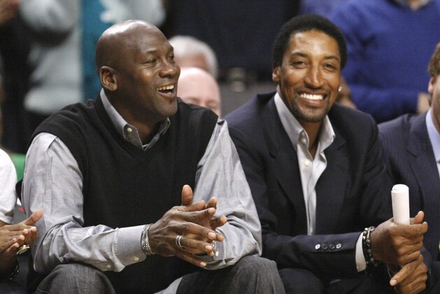 Chicago Bulls' greats Michael Jordan, left, and Scottie Pippen sit court side during the first half of an NBA basketball game between the Chicago Bulls and the Charlotte Bobcats Tuesday, Feb. 15, 2011, in Chicago. (AP Photo/Charles Rex Arbogast)