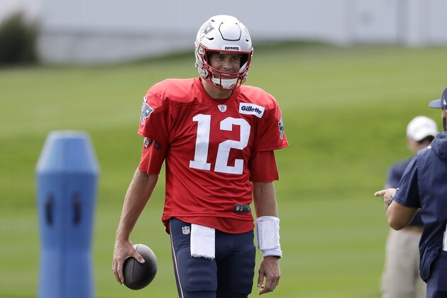 New England Patriots quarterback Tom Brady smiles while warming up during an NFL football practice, Wednesday, Sept. 4, 2019, in Foxborough, Mass. (AP Photo/Steven Senne)