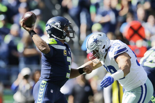 Seattle Seahawks quarterback Russell Wilson prepares to pass as Dallas Cowboys defensive end Tyrone Crawford, right, moves in for a hit during the first half of an NFL football game, Sunday, Sept. 23, 2018, in Seattle. (AP Photo/John Froschauer) Seattle Seahawks quarterback Russell Wilson prepares to pass as Dallas Cowboys defensive end Tyrone Crawford, right, moves in for a hit during the first half of an NFL football game, Sunday, Sept. 23, 2018, in Seattle. (AP Photo/John Froschauer)