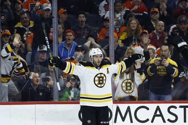 Boston Bruins' Patrice Bergeron celebrates after scoring a goal during the third period of an NHL hockey game against the Philadelphia Flyers, Tuesday, March 10, 2020, in Philadelphia. Boston won 2-0. (AP Photo/Matt Slocum)