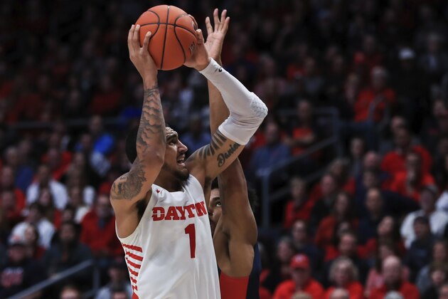 Dayton's Obi Toppin (1) drives to the basket against Duquesne's Michael Hughes (21) in the second half of an NCAA college basketball game, Saturday, Feb. 22, 2020, in Dayton, Ohio.Dayton won 80-70. (AP Photo/Aaron Doster) Dayton's Obi Toppin (1) drives to the basket against Duquesne's Michael Hughes (21) in the second half of an NCAA college basketball game, Saturday, Feb. 22, 2020, in Dayton, Ohio.Dayton won 80-70. (AP Photo/Aaron Doster)