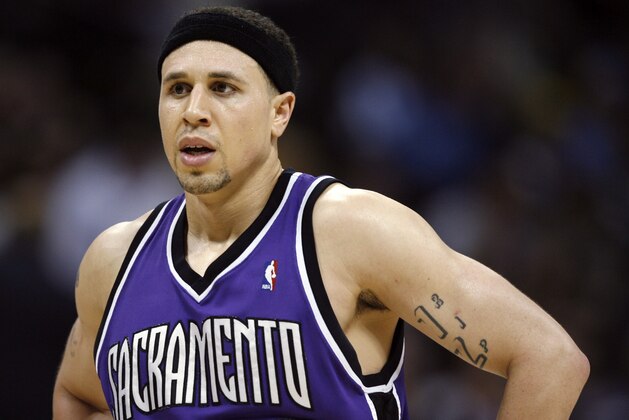 FILE - In this April 4, 2007, file photo, Sacramento Kings guard Mike Bibby stands on the court as time runs out during an NBA basketball game against the Denver Nuggets in Denver. Phoenix police are not recommending any charges against former NBA player Bibby following an investigation into accusations of sexual abuse and harassment of a teacher at a suburban high school. A police spokesman, Sgt. Vince Lewis, says the investigation did not find probable cause for charges against Bibby, who through his attorney denied the allegations made by a Shadow Mountain High School teacher. (AP Photo/David Zalubowski, File)