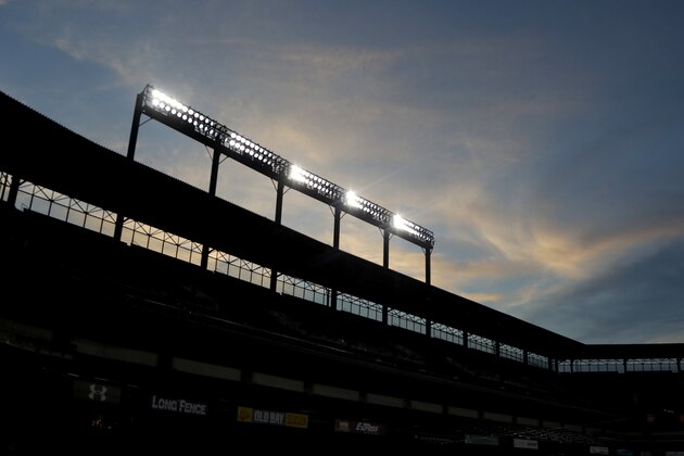 A colorful evening is seen at Oriole Park at Camden Yards as Baltimore Orioles work out during baseball training camp, Wednesday, July 8, 2020, in Baltimore. (AP Photo/Julio Cortez)