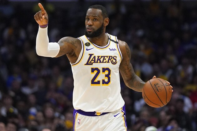 Los Angeles Lakers forward LeBron James gestures during the second half of an NBA basketball game against the Los Angeles Clippers Sunday, March 8, 2020, in Los Angeles. The Lakers won 112-103. (AP Photo/Mark J. Terrill)