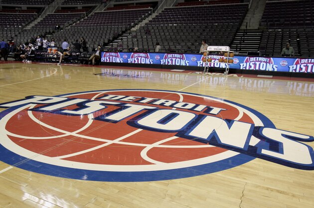 The Detroit Pistons logo on the basketball court before basketball game between the Pistons and the Milwaukee Bucks at The Palace Friday, April 8, 2011, in Auburn Hills, Mich. The Pistons announced Friday that billionaire California investor Tom Gores has agreed to buy the struggling NBA franchise. (AP Photo/Duane Burleson)