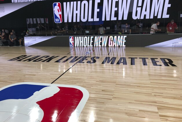 A basketball court is shown at the ESPN Wide World of Sports complex in Kissimmee, Fla., Tuesday, July 21, 2020. The NBA's marketing motto for the restart of the season at Walt Disney World is “Whole New Game,” and in many respects, that’s very true. (AP Photo/Tim Reynolds)