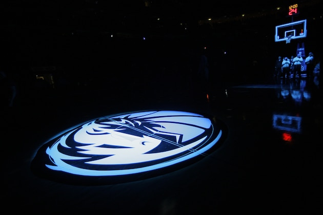 FILE - In this Jan. 5, 2010, file photo, the Dallas Mavericks logo is shown during an NBA basketball game against the Detroit Pistons in Dallas. The Dallas Mavericks have hired outside counsel to investigate allegations of inappropriate conduct by former team president Terdema Ussery in a Sports Illustrated report that described a hostile workplace for women. Ussery was accused of making sexually suggestive remarks to several women. He spent 18 years with the team before going to the sports apparel company Under Armour in 2015. Ussery, who was investigated by the team over similar claims in 1998, denied the allegations in a statement to SI. (AP Photo/Tony Gutierrez, File)