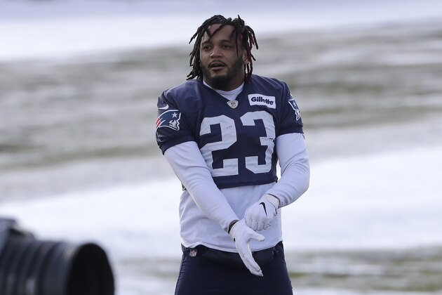 New England Patriots strong safety Patrick Chung pulls on a glove while warming up during an NFL football practice, Wednesday, Dec. 18, 2019, in Foxborough, Mass. (AP Photo/Steven Senne)