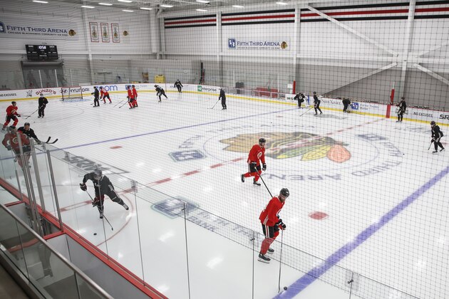 Chicago Blackhawks players skate during NHL hockey practice at Fifth Third Arena on Monday, July 13, 2020, in Chicago. (AP Photo/Kamil Krzaczynski)