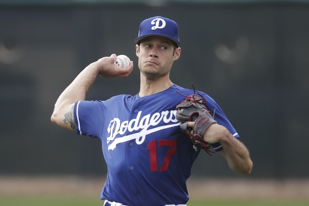 Los Angeles Dodgers' Joe Kelly throws during a spring training baseball workout Wednesday, Feb. 13, 2019, in Glendale, Ariz. (AP Photo/Morry Gash)