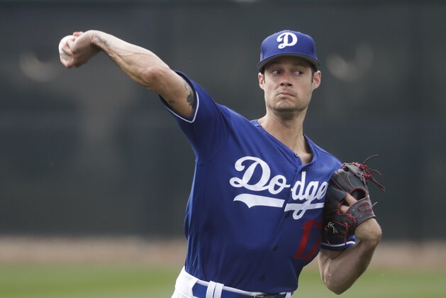 Los Angeles Dodgers' Joe Kelly throws during a spring training baseball workout Wednesday, Feb. 13, 2019, in Glendale, Ariz. (AP Photo/Morry Gash)