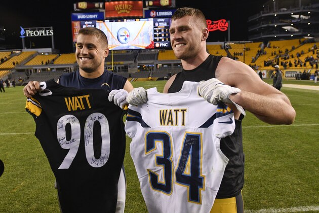 Brothers, Pittsburgh Steelers outside linebacker T.J. Watt (90), right, and Los Angeles Chargers fullback Derek Watt (34) pose after exchanging jerseys after an NFL football game, Sunday, Dec. 2, 2018, in Pittsburgh. (AP Photo/Don Wright)