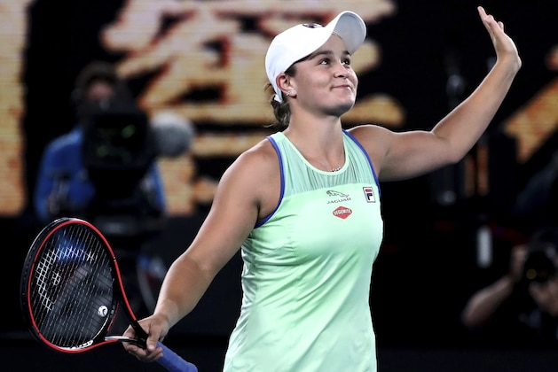 Australia's Ashleigh Barty celebrates after defeating Alison Riske of the U.S. during their fourth round singles match at the Australian Open tennis championship in Melbourne, Australia, Sunday, Jan. 26, 2020. (AP Photo/Dita Alangkara)