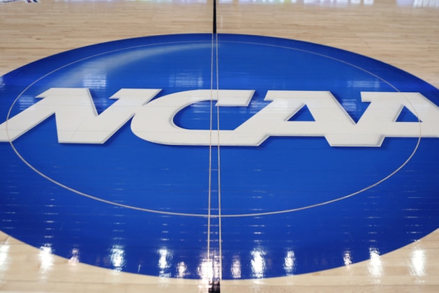 FILE - In this March 18, 2015, file photo, the NCAA logo is displayed at center court as work continues at The Consol Energy Center in Pittsburgh, for the NCAA college basketball tournament. The NCAA is opening a door for states with legalized sports gambling to host NCAA championship events. The governing body for college sports on Thursday, May 17, 2018, announced a