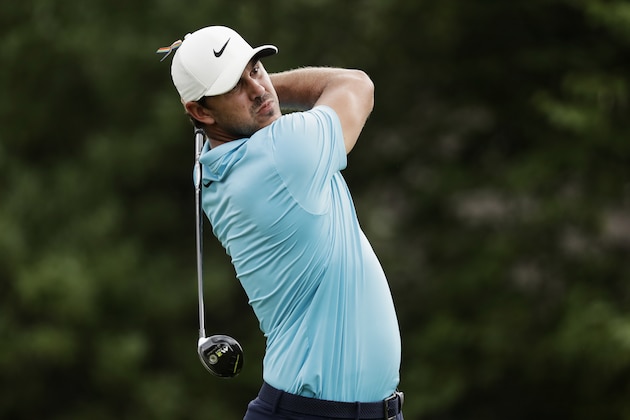 Brooks Koepka watches his tee shot on the 18th hole during the first round of the World Golf Championship-FedEx St. Jude Invitational Thursday, July 30, 2020, in Memphis, Tenn. (AP Photo/Mark Humphrey)