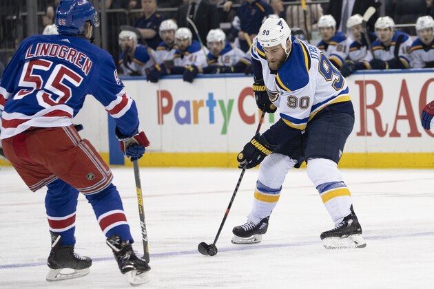 St. Louis Blues center Ryan O'Reilly (90) controls the puck skating against New York Rangers defenseman Ryan Lindgren (55) during the first period of an NHL hockey game, Tuesday, March 3, 2020, at Madison Square Garden in New York. (AP Photo/Mary Altaffer) St. Louis Blues center Ryan O'Reilly (90) controls the puck skating against New York Rangers defenseman Ryan Lindgren (55) during the first period of an NHL hockey game, Tuesday, March 3, 2020, at Madison Square Garden in New York. (AP Photo/Mary Altaffer)