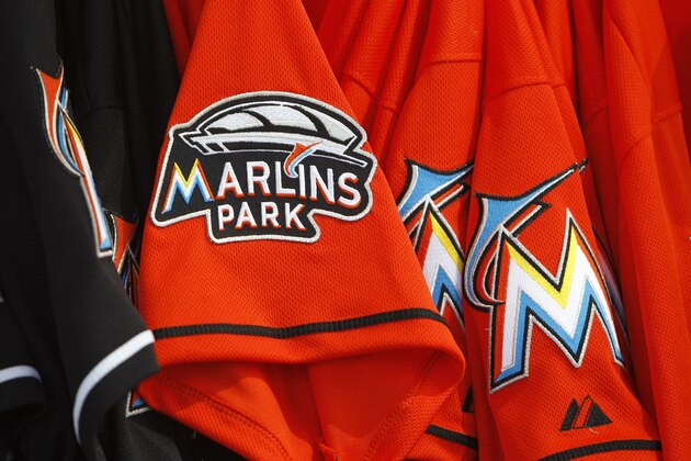 Shirts with a logo of the new Marlins Park stadium are on sale before an Opening Day baseball game between the Miami Marlins and St. Louis Cardinals, Wednesday, April 4, 2012, in Miami. (AP Photo/Lynne Sladky)