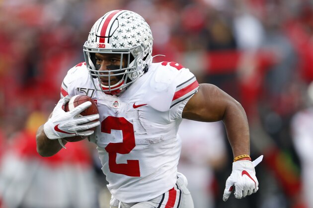 Ohio State running back J.K. Dobbins runs for a 33-yard touchdown against Michigan in the second half of an NCAA college football game in Ann Arbor, Mich., Saturday, Nov. 30, 2019. (AP Photo/Paul Sancya)