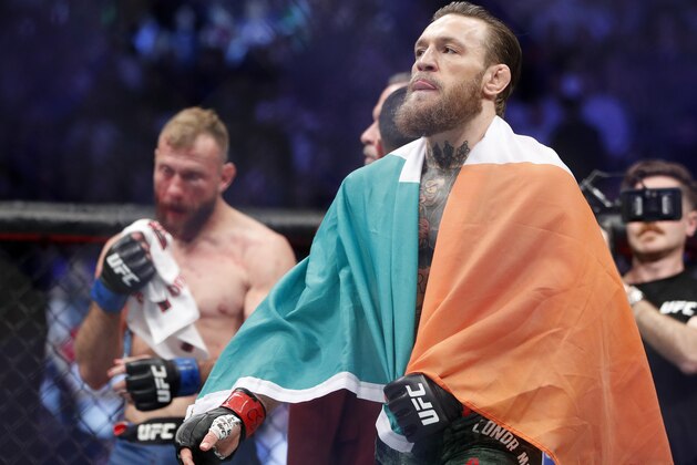 Conor McGregor celebrates after defeating Donald