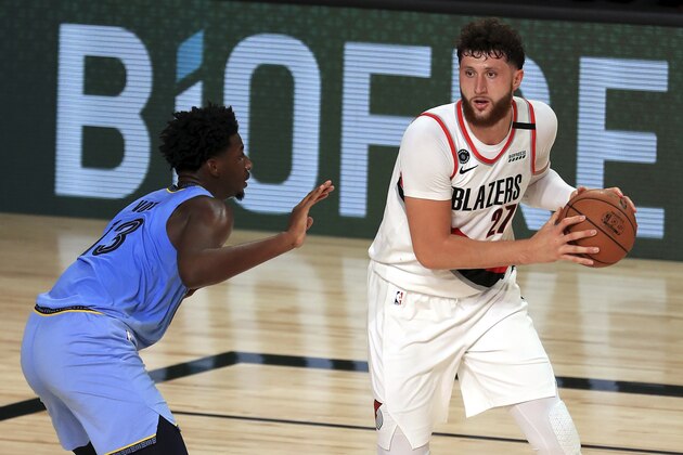 Memphis Grizzlies Jaren Jackson Jr. (3) defends Portland Trail Blazers Jusuf Nurkic (27) during the second half of an NBA basketball game Friday, July 31, 2020, in Lake Buena Vista, Fla. (Mike Ehrmann/Pool Photo via AP)