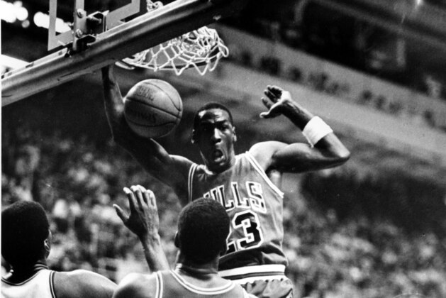 Chicago Bulls Michael Jordan (23) reacts after slamming the ball during NBA playoff game at the Boston Garden, Ma., Sunday afternoon, April 21, 1986.  The Boston Celtics beat the Bulls, 135-131 in double overtime.  (AP Photo/Elise Amendola)