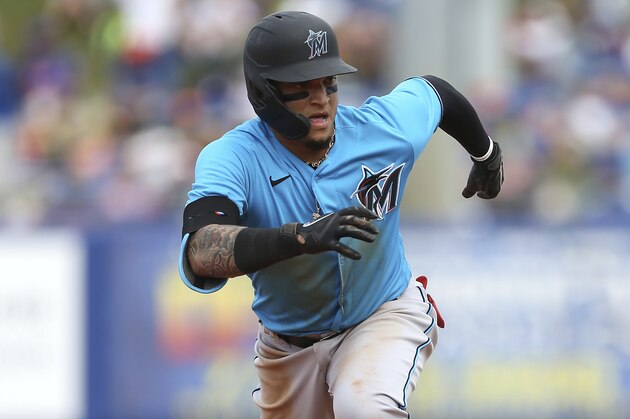 Miami Marlins' Isan Diaz runs to third during a spring training baseball game against the New York Mets on Saturday, Feb 22, 2020, in Port St. Lucie, Fla. The Marlins won 5-3. (AP Photo/Vera Nieuwenhuis)