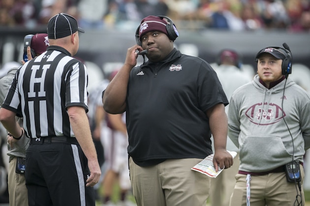 Mississippi State tight ends coach D.J. Looney watches the video board from the sidelines during the first half of the TaxSlayer Bowl NCAA college football game against Louisville, Saturday, Dec. 30, 2017, in Jacksonville, Fla. (AP Photo/Stephen B. Morton)