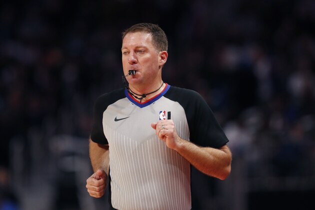 Referee Brent Barnaky runs up court during the second half of an NBA basketball game between the Detroit Pistons and the Milwaukee Bucks, Thursday, Feb. 20, 2020, in Detroit. (AP Photo/Carlos Osorio)
