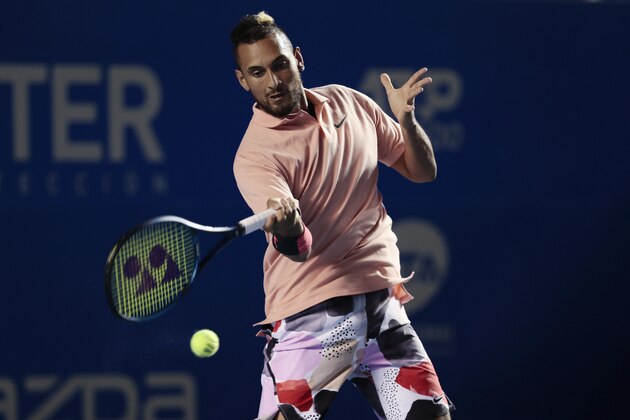 Australia's Nick Kyrgios, defending champion of the Mexican Open tennis tournament, hits a forehand to France's Ugo Humbert during the first set in Acapulco, Mexico, Tuesday, Feb. 25, 2020. Kyrgios retired from the match after the first set with an injury. (AP Photo/Rebecca Blackwell)