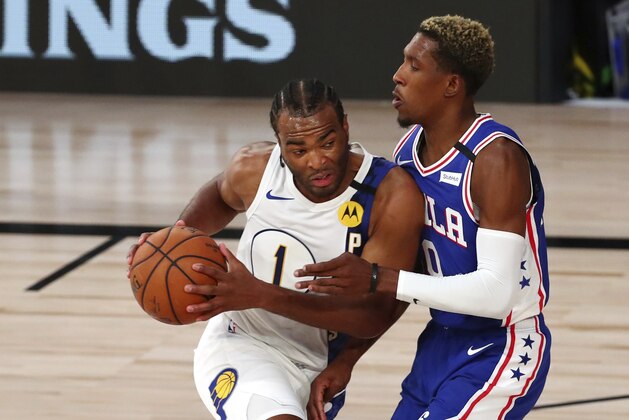 Indiana Pacers forward T.J. Warren (1) drives to the basket against Philadelphia 76ers guard Josh Richardson (0) during the first quarter of an NBA basketball game Saturday, Aug. 1, 2020, in Lake Buena Vista, Fla. (Kim Klement/Pool Photo via AP) Indiana Pacers forward T.J. Warren (1) drives to the basket against Philadelphia 76ers guard Josh Richardson (0) during the first quarter of an NBA basketball game Saturday, Aug. 1, 2020, in Lake Buena Vista, Fla. (Kim Klement/Pool Photo via AP)