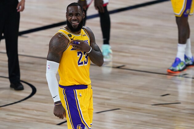 Los Angeles Lakers' LeBron James (23) reacts after a play against the Toronto Raptors during the second half of an NBA basketball game Saturday, Aug. 1, 2020, in Lake Buena Vista, Fla. (AP Photo/Ashley Landis, Pool)