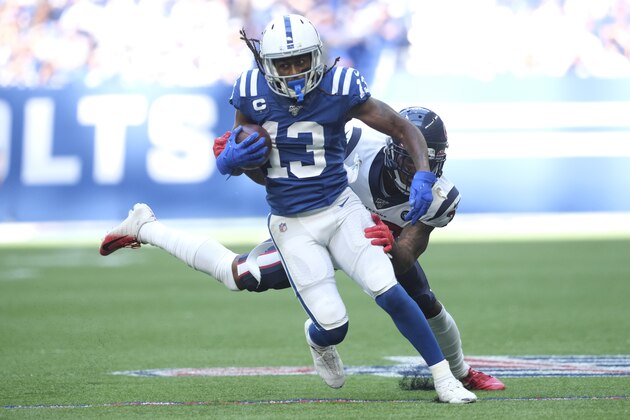 Indianapolis Colts' T.Y. Hilton (13) runs out of the tackle of Houston Texans' Lonnie Johnson (32) during the second half of an NFL football game, Sunday, Oct. 20, 2019, in Indianapolis. (AP Photo/AJ Mast)