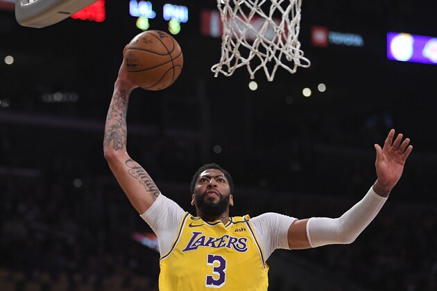 Los Angeles Lakers forward Anthony Davis shoots during the first half of an NBA basketball game against the Philadelphia 76ers Tuesday, March 3, 2020, in Los Angeles. (AP Photo/Mark J. Terrill) Los Angeles Lakers forward Anthony Davis shoots during the first half of an NBA basketball game against the Philadelphia 76ers Tuesday, March 3, 2020, in Los Angeles. (AP Photo/Mark J. Terrill)