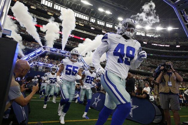 Dallas Cowboys' Jamize Olawale (49) leads Leighton Vander Esch (55) and C.J. Goodwin (29) out onto the field for an NFL football game against the Green Bay Packers in Arlington, Texas, Sunday, Oct. 6, 2019. (AP Photo/Roger Steinman)