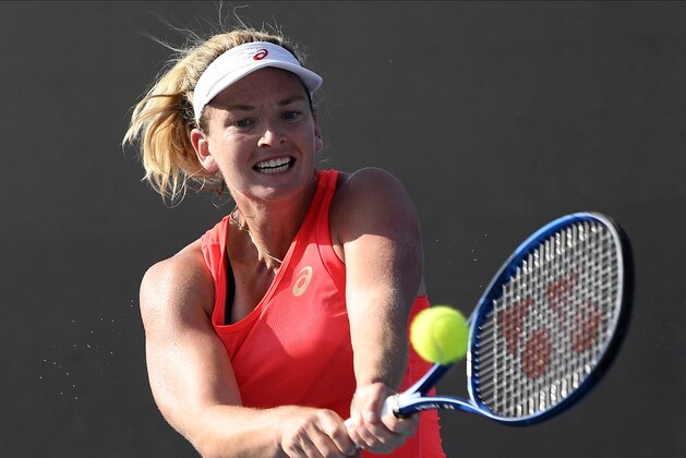 Coco Vandeweghe U.S. makes a backhand return to Germany's Laura Siegemund during their first round singles match at the Australian Open tennis championship in Melbourne, Australia, Tuesday, Jan. 21, 2020. (AP Photo/Andy Brownbill)